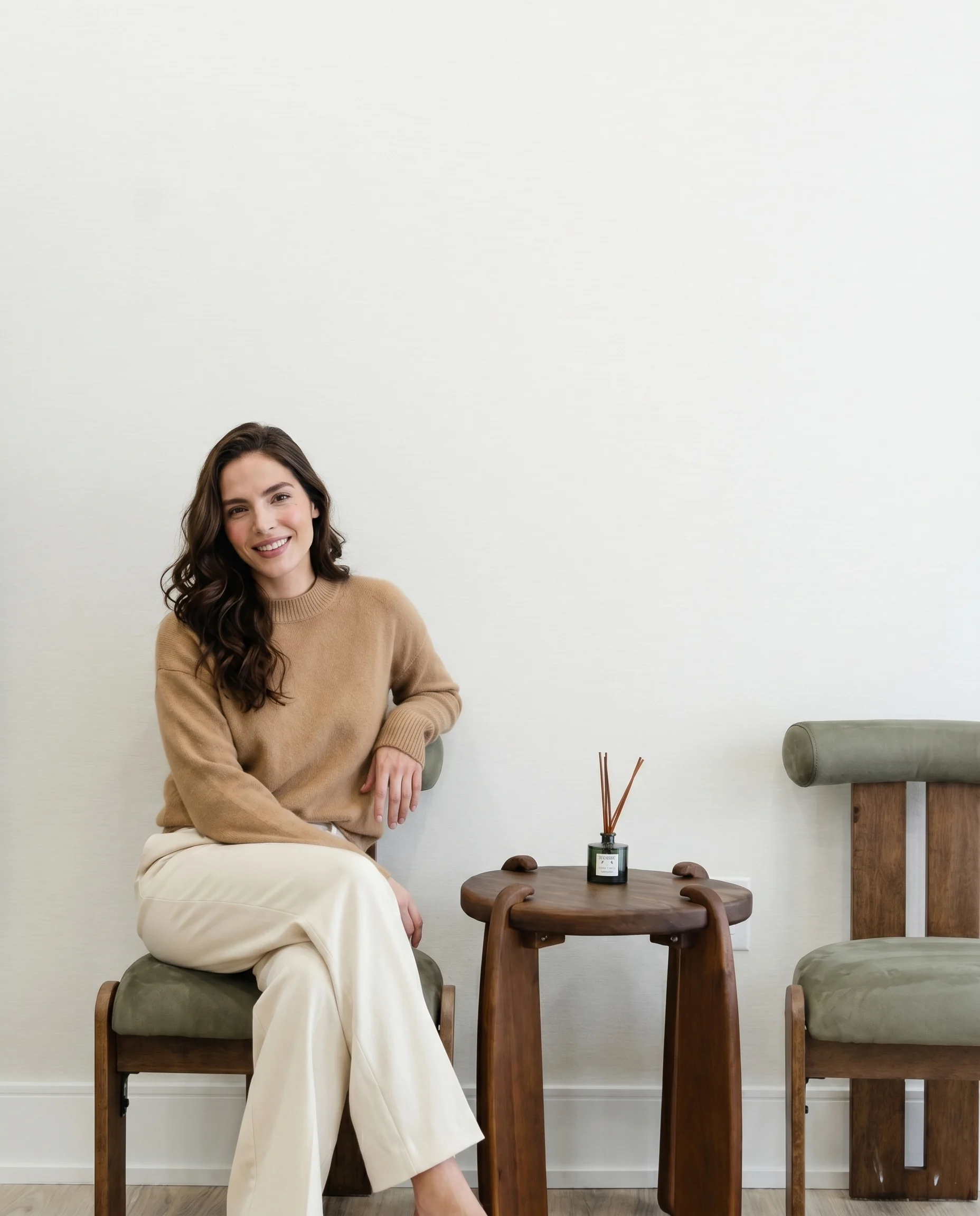 A person smiling in warm natural light at seesmile