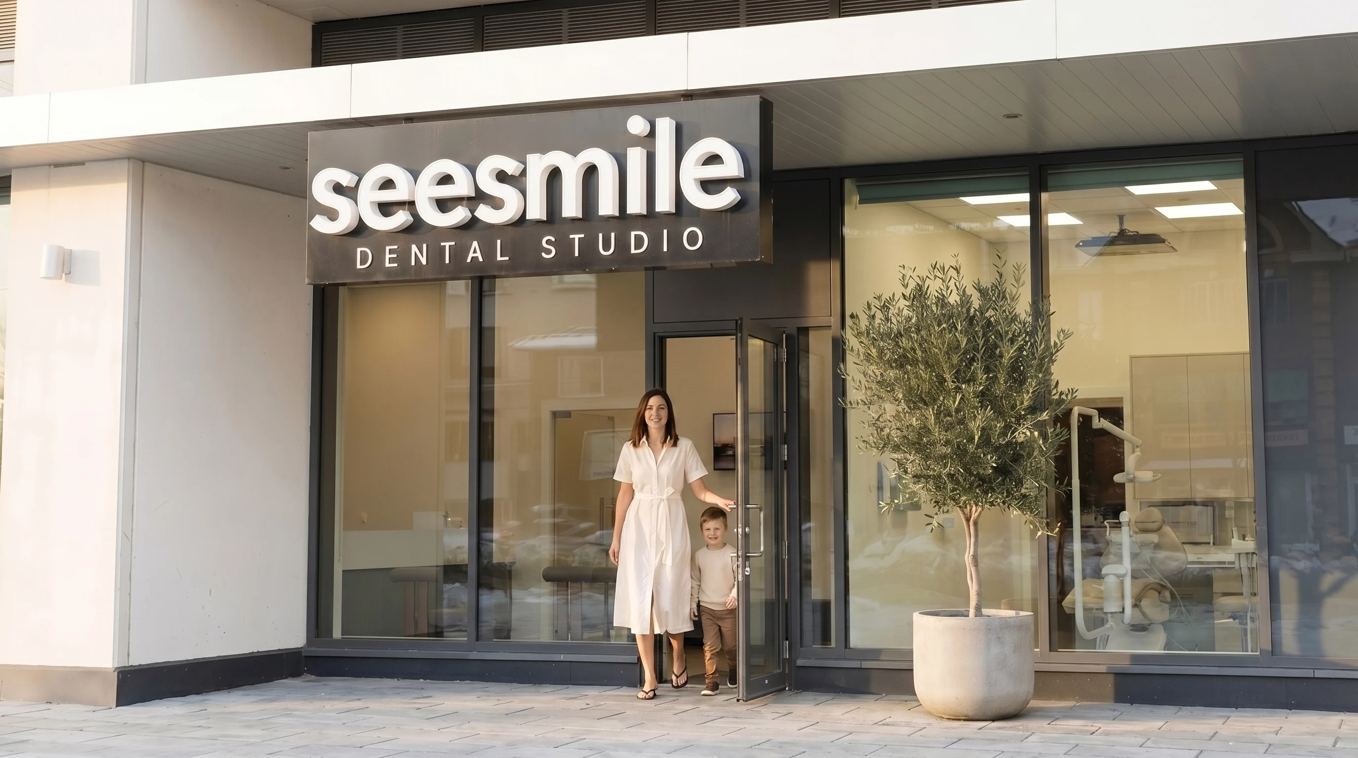 A mother and child at the entrance of the seesmile Dental Studio